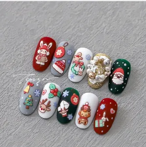 Detail of Christmas nail art stickers with embossed Santa and snowflake patterns