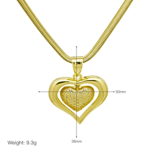 Close-up of gold heart pendant with crystal inlay, size 30x36mm, weight 9.3g on snake chain