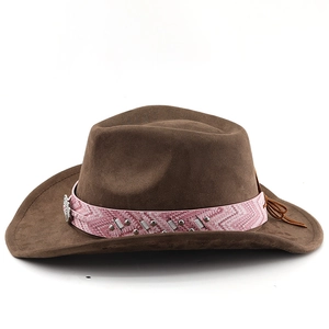 Detail of brown suede cowboy hat featuring pink patterned band and silver engraved buckle