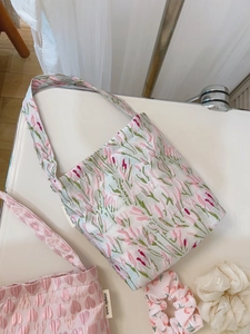 Pink heart embroidery and floral fabric handbags with simple wish label on white background