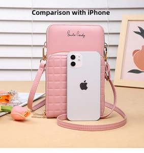 Detail of pink quilted PU leather crossbody phone bag with double zipper and shoulder strap