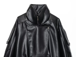 Detailed macro view of black grain PU leather jacket featuring zippered high collar design