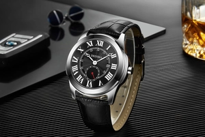 Close-up of DEDIMA men's watch with Roman numerals, calendar, and black leather strap