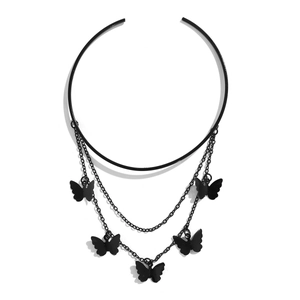 Close-up of black gothic butterfly choker with layered chains and metal butterfly pendants