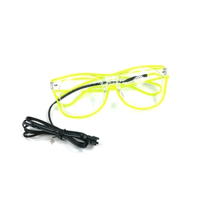 Macro view of transparent LED glasses with yellow glowing frame and power cable details