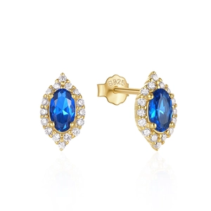 Detail view of gold S925 silver stud earrings with blue cat eye stone and tiny diamonds