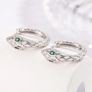 Silver snake hoop earrings with green gemstone eyes and detailed scale texture