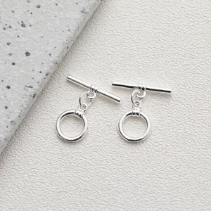 Macro shot of silver-plated 14K gold toggle clasps for DIY jewelry making material