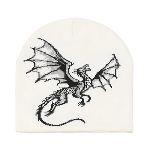 Close-up of the cream knit beanie featuring a black and grey dragon graphic pattern