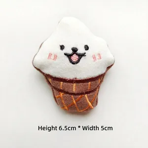 Detail view of plush ice cream charm with smiley embroidery, dimensions H 6.5cm and W 5cm
