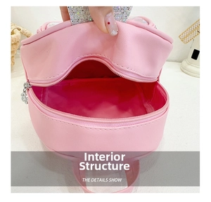 Internal structure of a pink glitter crown backpack for kids showing spacious lining
