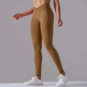 Detail of cross V-shaped high waist seamless yoga pants in earthy brown with texture