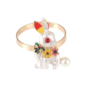 Enamel rabbit napkin ring with colorful stones and pearl detail on gold metal band