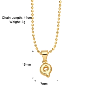 Detailed size measurement of a gold letter Q pendant with dimensions 15mm by 7mm