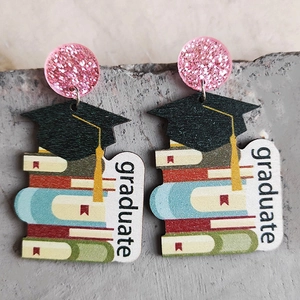 Handmade graduation wooden earrings with colorful books pattern and graduate text