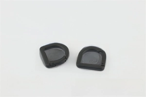 Close-up of matte black D-ring spring clasps for handbag straps and hardware