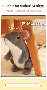 Close-up of soft gray plush mouse toy texture and cute pink ears in home setting