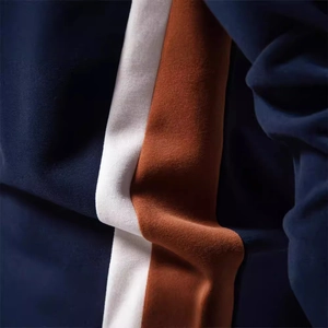 Men's slim fit long sleeve sweatshirt featuring navy, white and rust patchwork design