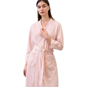 Pink waffle texture bathrobe for women with tie belt and double pockets on white background