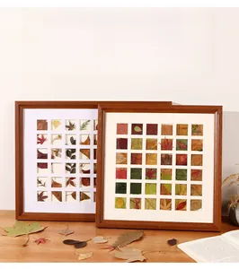 Detail of DIY wooden grid frame with 25 slots for organizing autumn leaf specimens