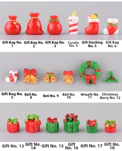 Macro detail of 18 resin Christmas figurines including stockings, bells and gift boxes