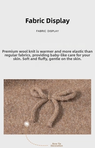 Detail shot of the chunky knit texture and 3D bow decoration on the winter scarf