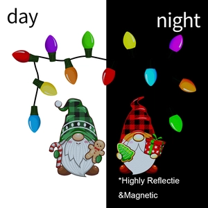 Day and night comparison of reflective gnome and Christmas bulb magnetic car stickers