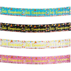 Detail of four colorful Feliz Cumpleaños foil banners with gold glitter text and tassels