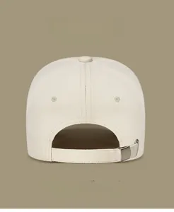 Detail view of cotton baseball cap back with adjustable strap and metal buckle closure