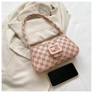 Pink printed baguette bag on blazer with smartphone for size reference