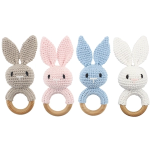 Handmade crochet bunny rattles for babies with natural wood rings in four soft colors