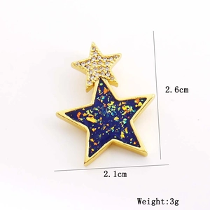 Détails de taille d'un pendentif double étoile bleu et or de 2,6cm x 2,1cm avec zircon