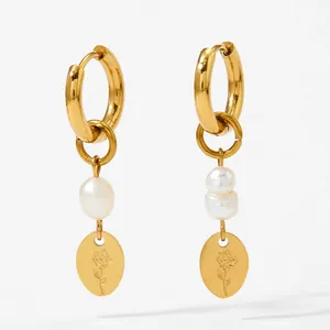 Elegant gold hoop earrings with natural pearls and engraved rose metal charms