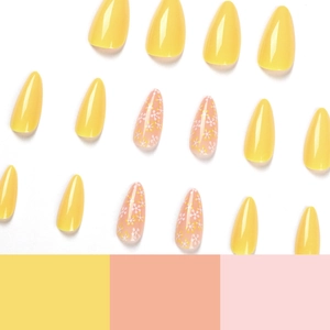 Faux ongles fleurs jaune et rose brillant de forme goutte d'eau sur fond blanc éclatant
