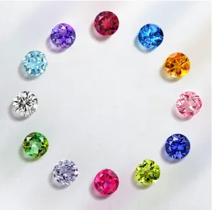 Macro shot of twelve vibrant round-cut birthstones arranged in a circular pattern for selection