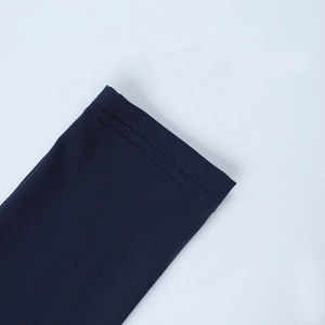Close-up of high-quality double-needle stitching on navy blue knit dress sleeve cuff