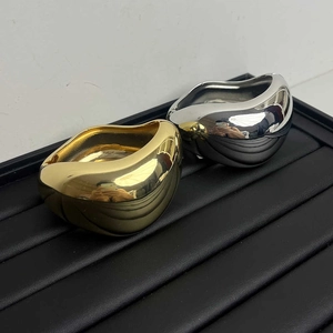 Polished chunky liquid metal geometric bangles in gold and silver finish for women
