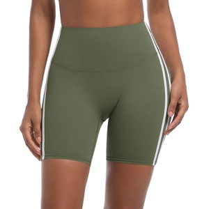 Detail of high-waisted olive green yoga shorts with white side stripes and stretch fabric
