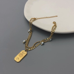 Double-layered 18K gold plated stainless steel bracelet with Turkish evil eye and sun pendant