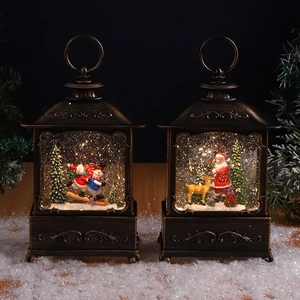 Close-up of bronze Christmas lantern with Santa scene and swirling glitter effect