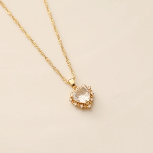 Sparkling gold heart pendant necklace with clear cubic zirconia on twisted rope chain