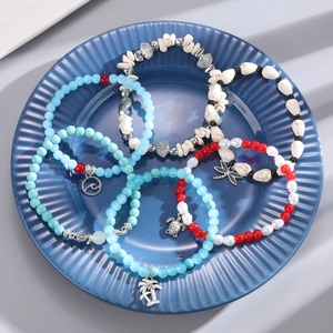 Set de 6 pulseras playeras bohemias con cuentas turquesas y dijes de temática marina