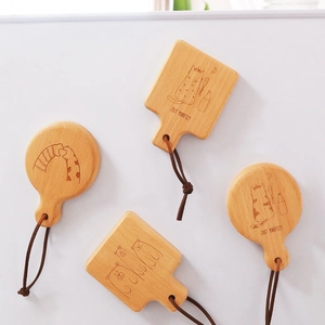 Custom wooden beer bottle opener with magnetic backing and cartoon animal engravings
