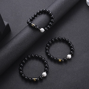 Black agate and white turquoise beaded bracelets with golden initial letter pendants