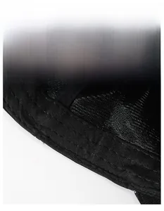 Detail view of the wide moisture-wicking sweatband and fine stitching inside the black cap