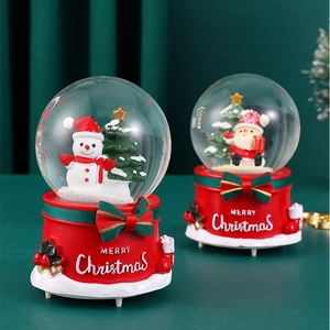 Colorful glowing Christmas crystal ball music box with Santa and snowman scenes