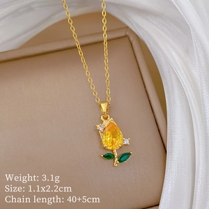 Detail view of tulip necklace with yellow teardrop gemstone and green leaf accents