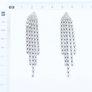 Detailed view of silver-tone tassel earrings with rhinestones measuring 7.5cm in length