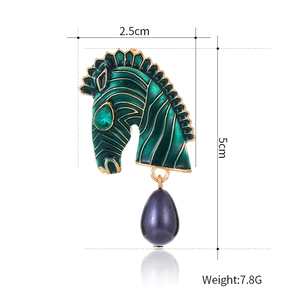 Vintage green enamel zebra head brooch with purple teardrop bead and gold accents