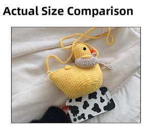 Size comparison of handmade crochet duck crossbody bag next to a mobile phone case